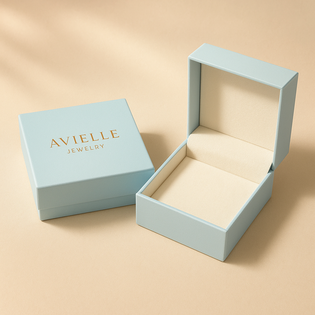 Elegant light blue Avielle Jewelry gift box with open interior on beige background, luxury minimalist packaging.