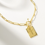 Delicate gold necklace with nail cross pendant for women