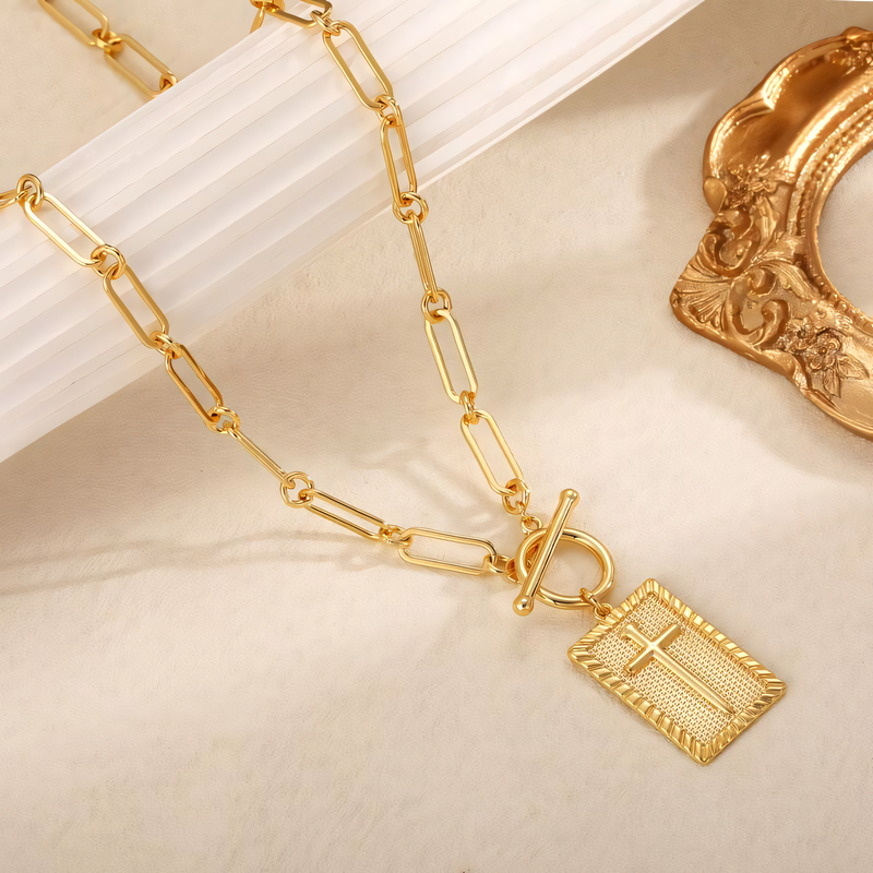 Delicate gold necklace with nail cross pendant for women