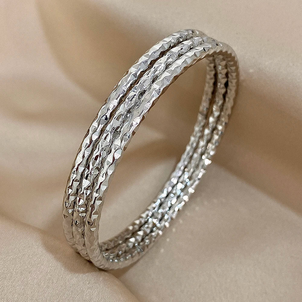 stackable geometric bangle set on wrist