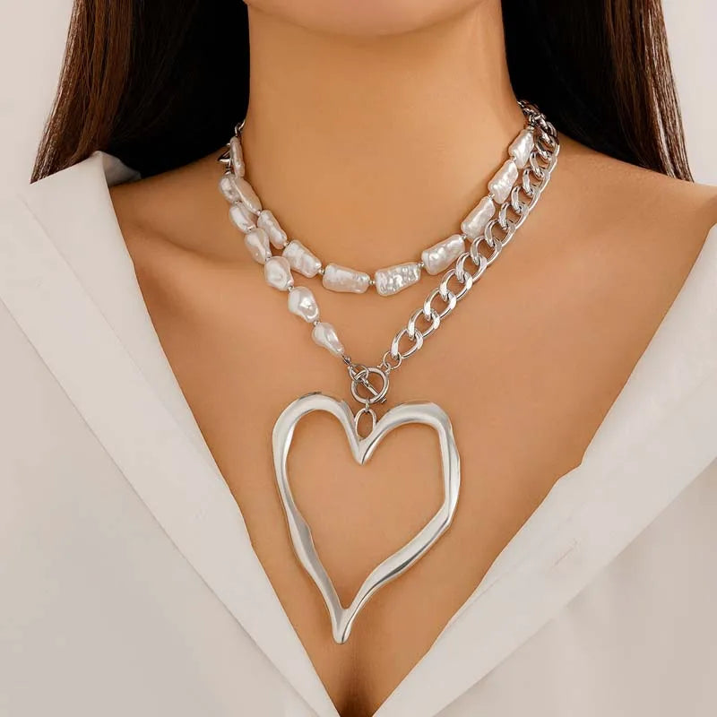 Layered heart necklace set on model