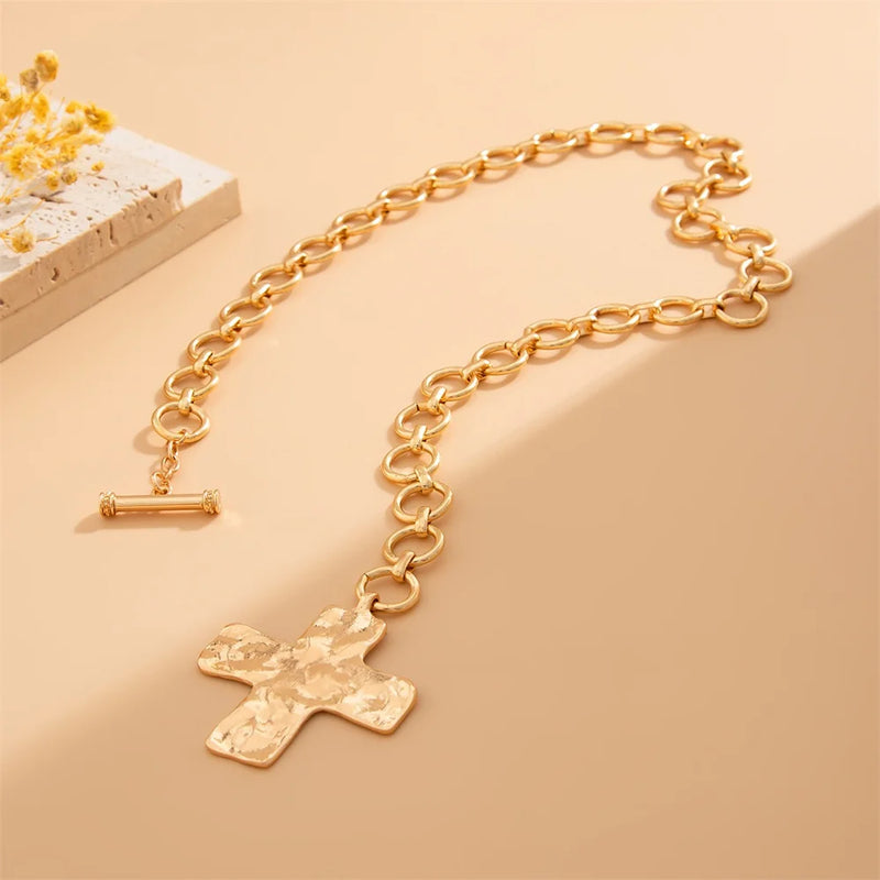 modern industrial cross pendant close-up