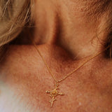 18k gold birth flower necklace close-up
