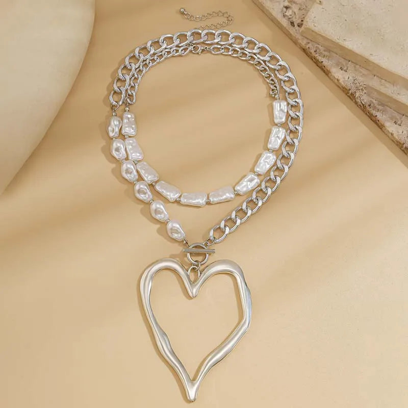 Baroque pearl heart pendant necklace close-up