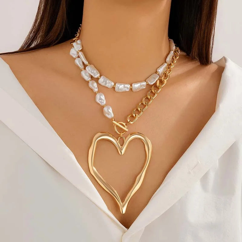 Layered heart necklace set on model