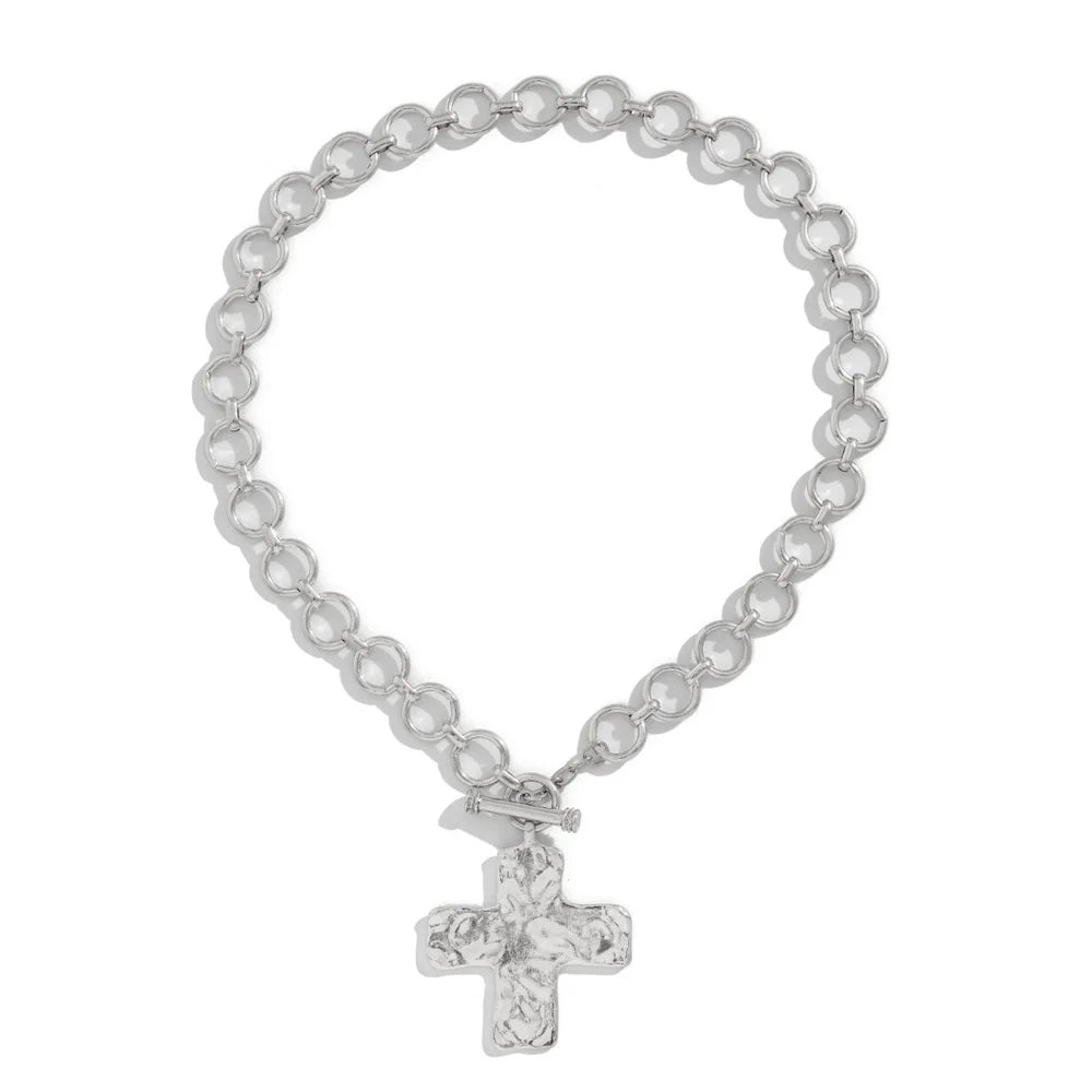 modern industrial cross pendant close-up