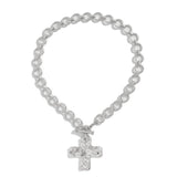 modern industrial cross pendant close-up