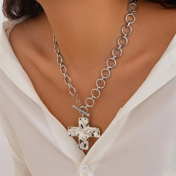 modern industrial cross pendant close-up