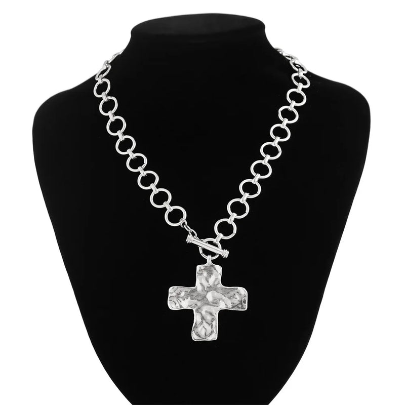 modern industrial cross pendant close-up