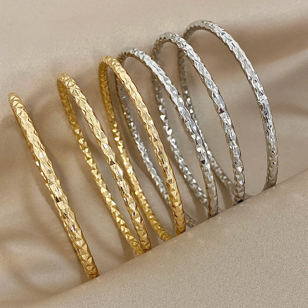 stackable geometric bangle set on wrist